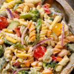 Colorful and vibrant pasta salad with fresh vegetables and a tangy dressing – a modern twist on a classic dish