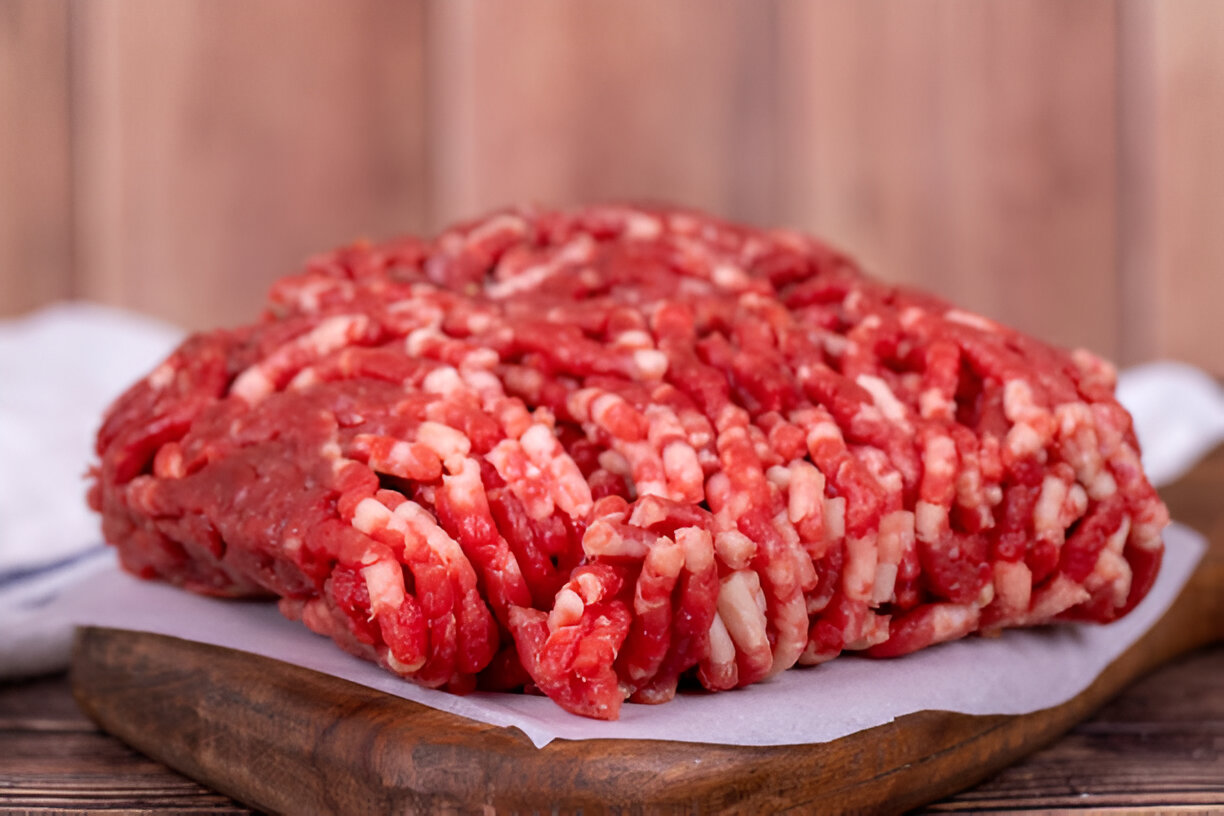 A beautifully plated dish featuring a nutritious ground beef recipe, garnished with fresh herbs and served with colorful vegetables.